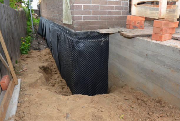 SJ Waterproofing Pros technician performing targeted Emergency Waterproofing assessment in Fishers, NY